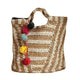 Woven tote bag with colorful pom-poms on a white background