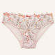 Light pink floral lace panties with a delicate ruffled waistband, featuring embroidered botanical patterns in soft pink, red, orange, and green on a cream mesh base, shown flat against a light beige background.