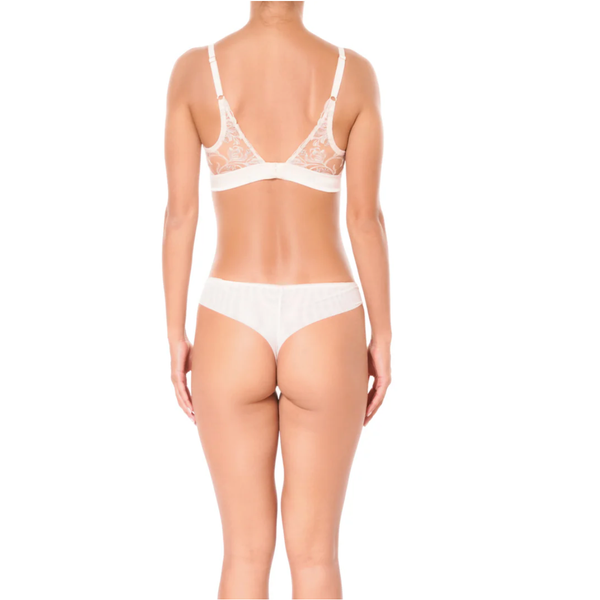 light pink lace lingerie set on a white background