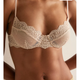 Lace bra and panties set on a neutral background