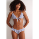 Woman wearing a blue and white striped bikini against a plain background