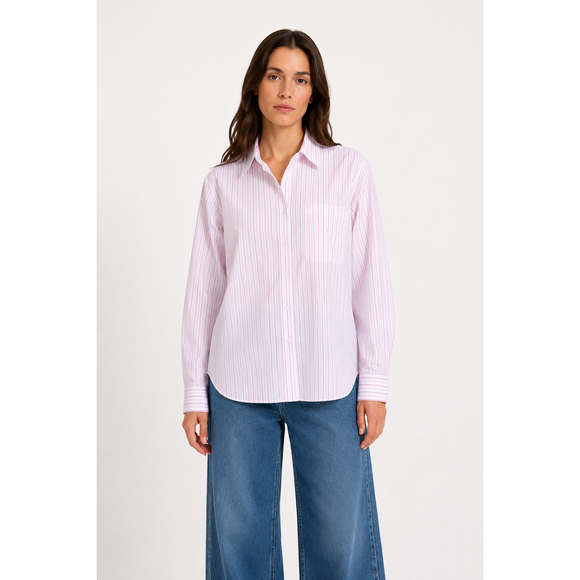 a woman wearing a purple and white button up stripe shirt on a white background