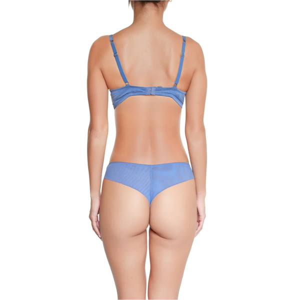 Rear view of a model wearing a light blue two-piece lingerie set against a plain white background.
