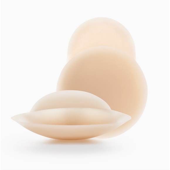 Three silicone breast implant silhouettes in varying sizes, arranged in a cascading stack on a clean white background.