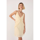 Woman wearing a light yellow dress with a white background