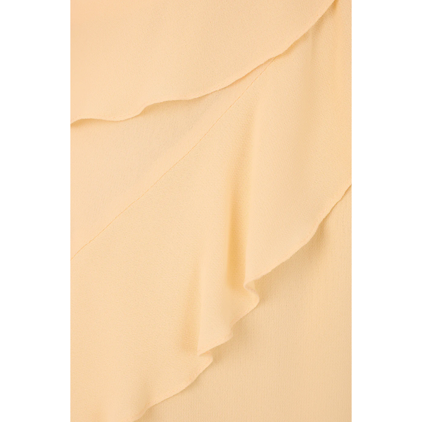 Close-up of beige fabric with ruffled layers