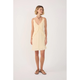Woman wearing a light yellow dress on a white background