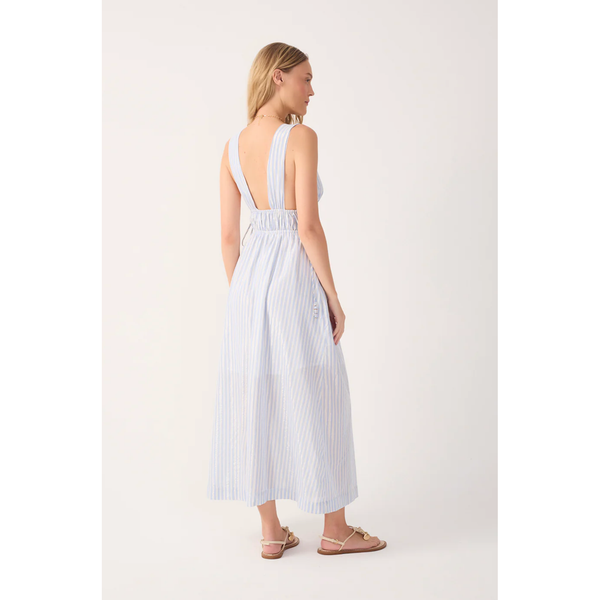 Woman wearing a white dress with thin straps on a white background