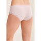 White lace-trimmed underwear on a beige background