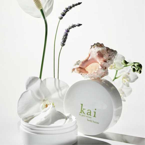 Kai body butter with flowers on a white background
