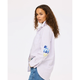 Woman wearing a white striped shirt with blue text and graphics on a white background