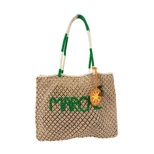 macrame tote with green lettering spelling"marche" and an orange macrame keychain on a white background