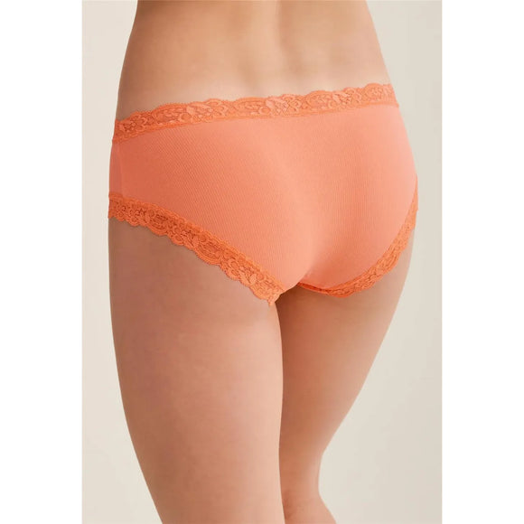 Orange lace underwear on a neutral background
