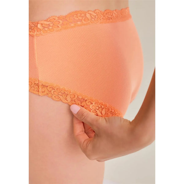 Close-up of peach-colored underwear with lace trim